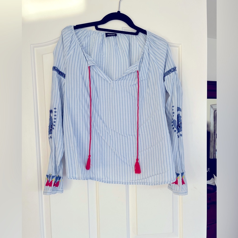 White and blue striped blouse with beautiful details.